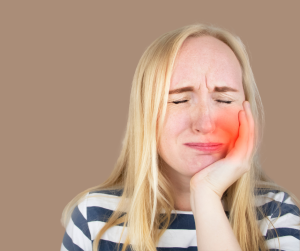 Woman Holding Mouth in Pain
