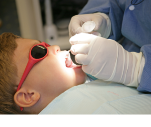 Child getting flouride treatment